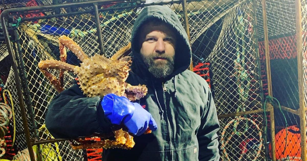 Scott Campbell Jr. holding a large crab on 'Deadliest Catch'