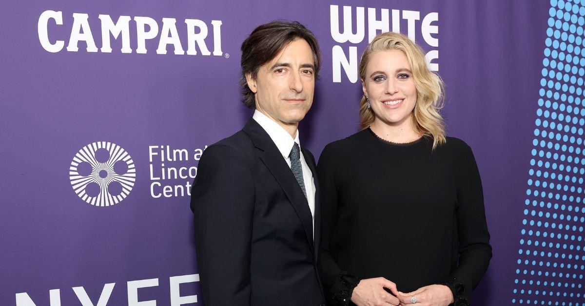 (l-r): Noah Baumbach and Greta Gerwig smiling on the red carpet.