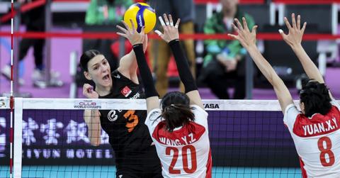 Volleyball players wearing tape on their fingers.