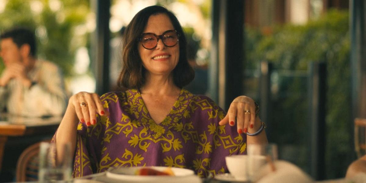 Victoria Ratliff at a table in The White Lotus