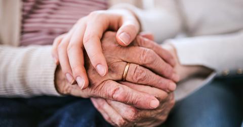 Hands of teenage girl and her grandmother at home