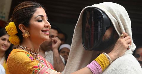 Shilpa Shetty adjusts Raj Kundra's mask