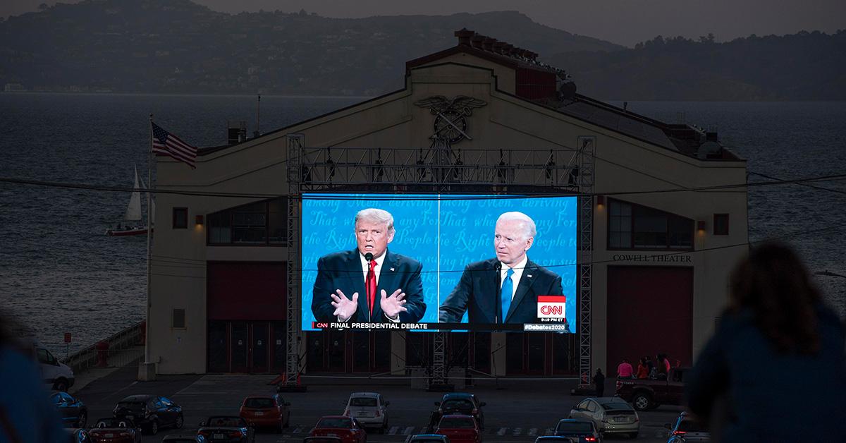 People watching the 2020 presidential debate on a giant screen. 