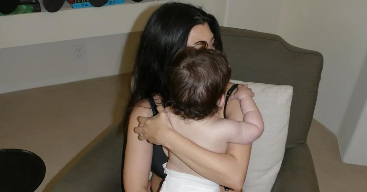 Kourtney Kardashian holding baby Rocky in April 2025.