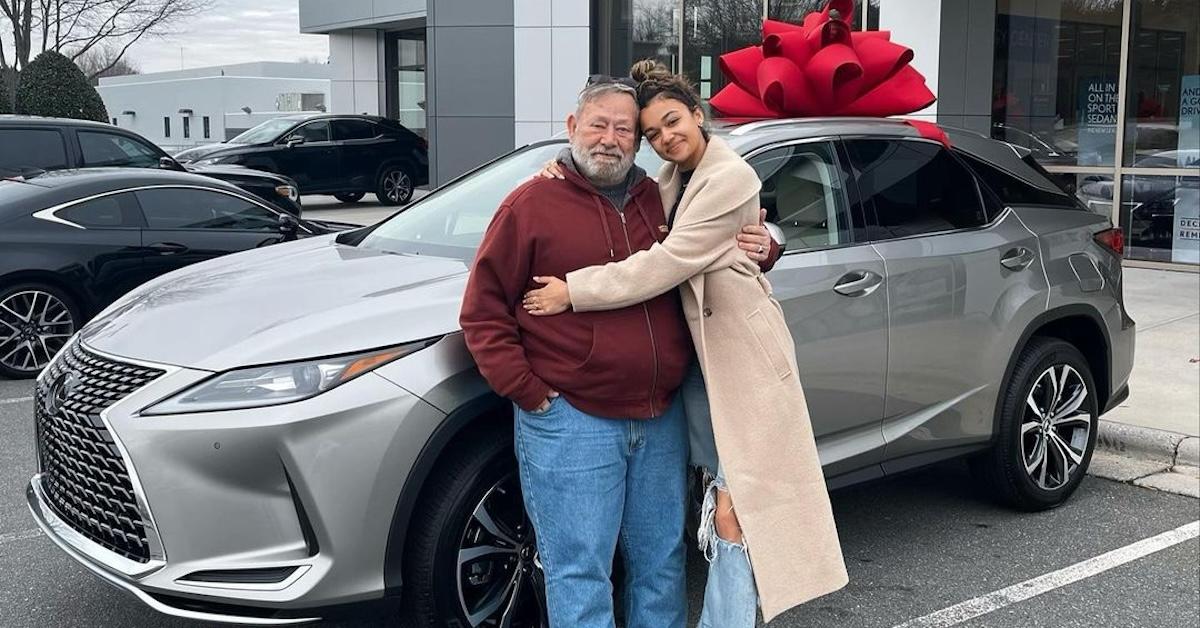 Madison Bailey and her dad with a new car