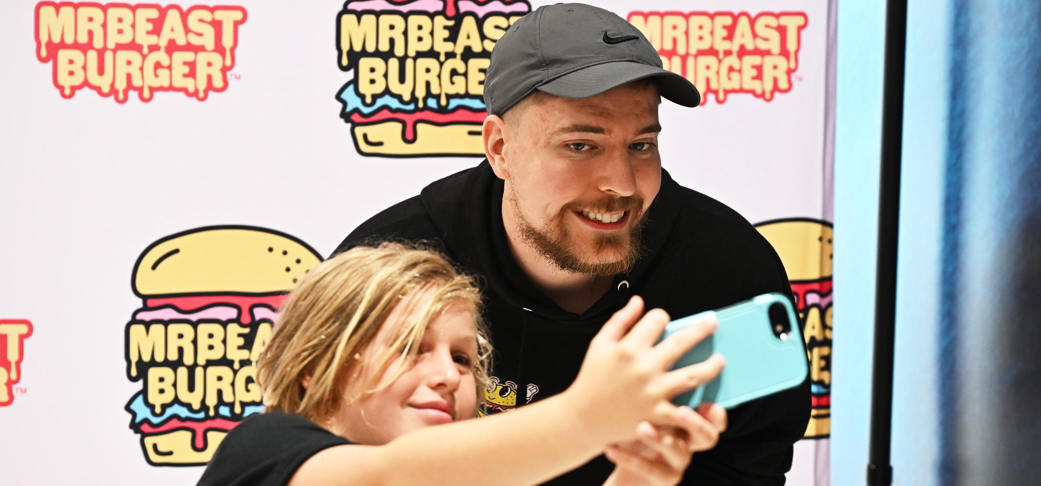  MrBeast poses with fan at the launch of the MrBeast Burger Restaurant at American Dream on Sept. 4, 2022