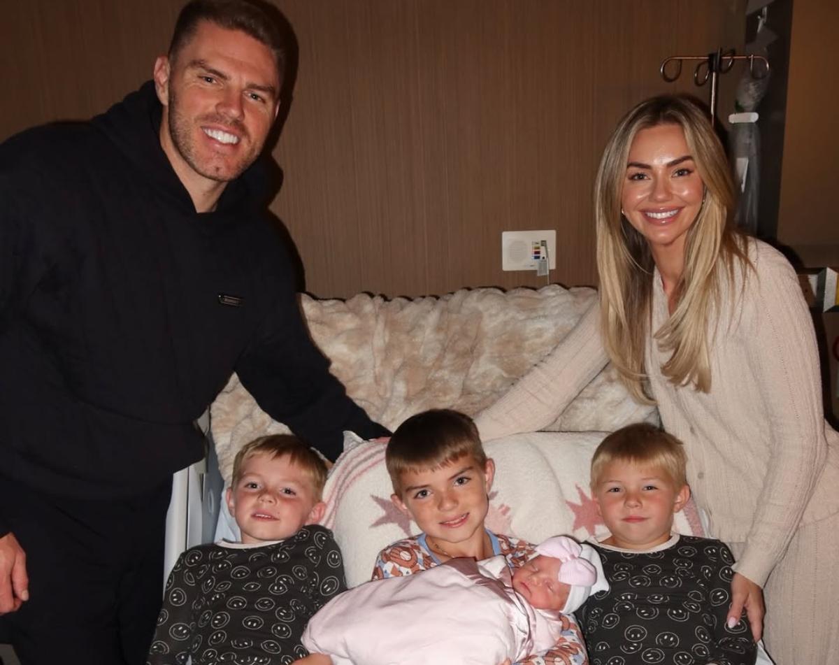 Freddie Freeman with his wife, their three sons, and their baby daughter.