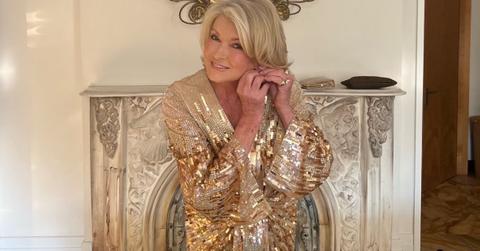 Martha Stewart putting on jewelry