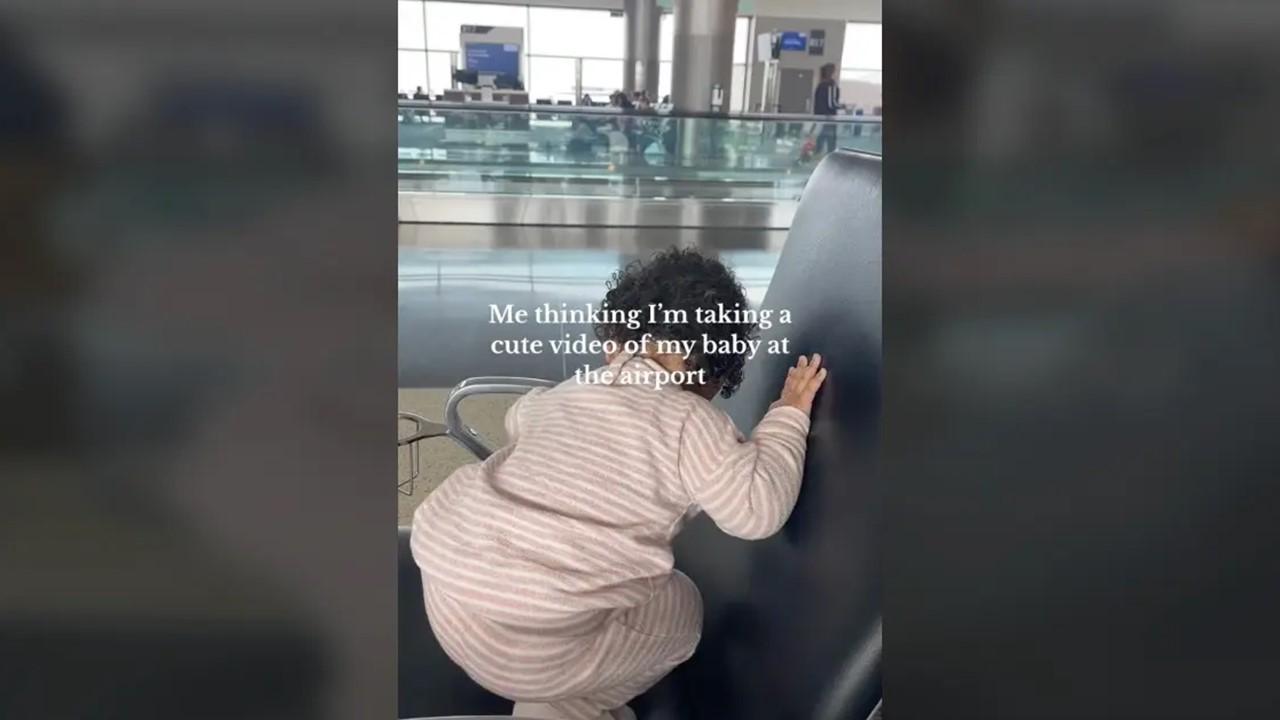 Baby sees a piece of gum at the airport