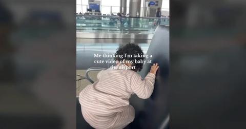Baby sees a piece of gum at the airport