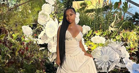 India Royale standing in a botanical garden in Singapore.