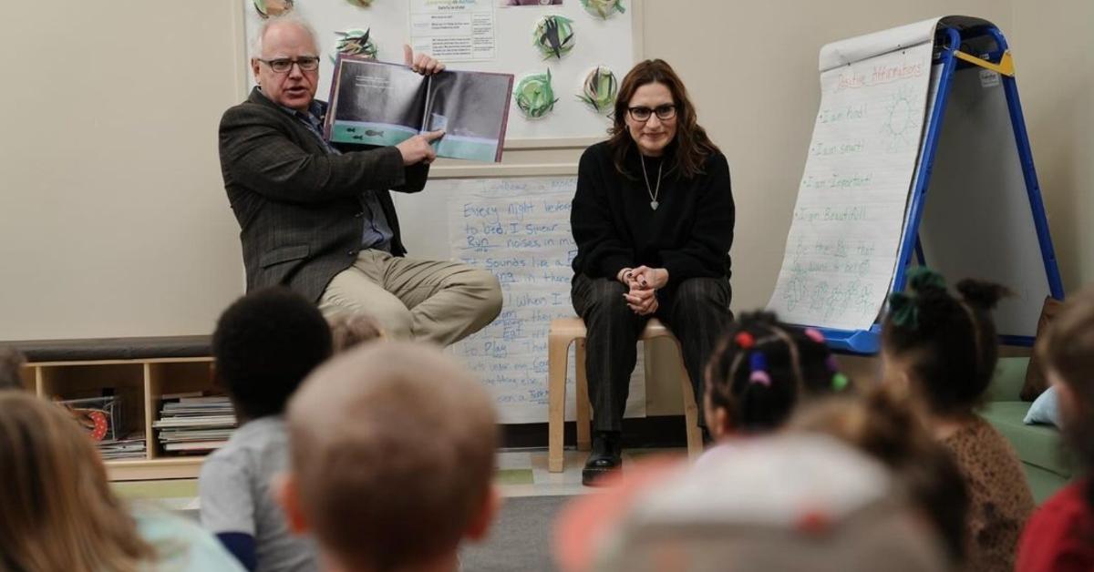 Tim Walz reads a book to a classroom of students