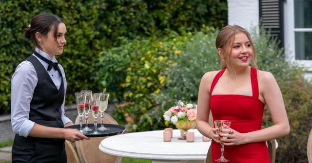 Lake and Lucy talking at the wedding in 'Love, Victor' Season 2