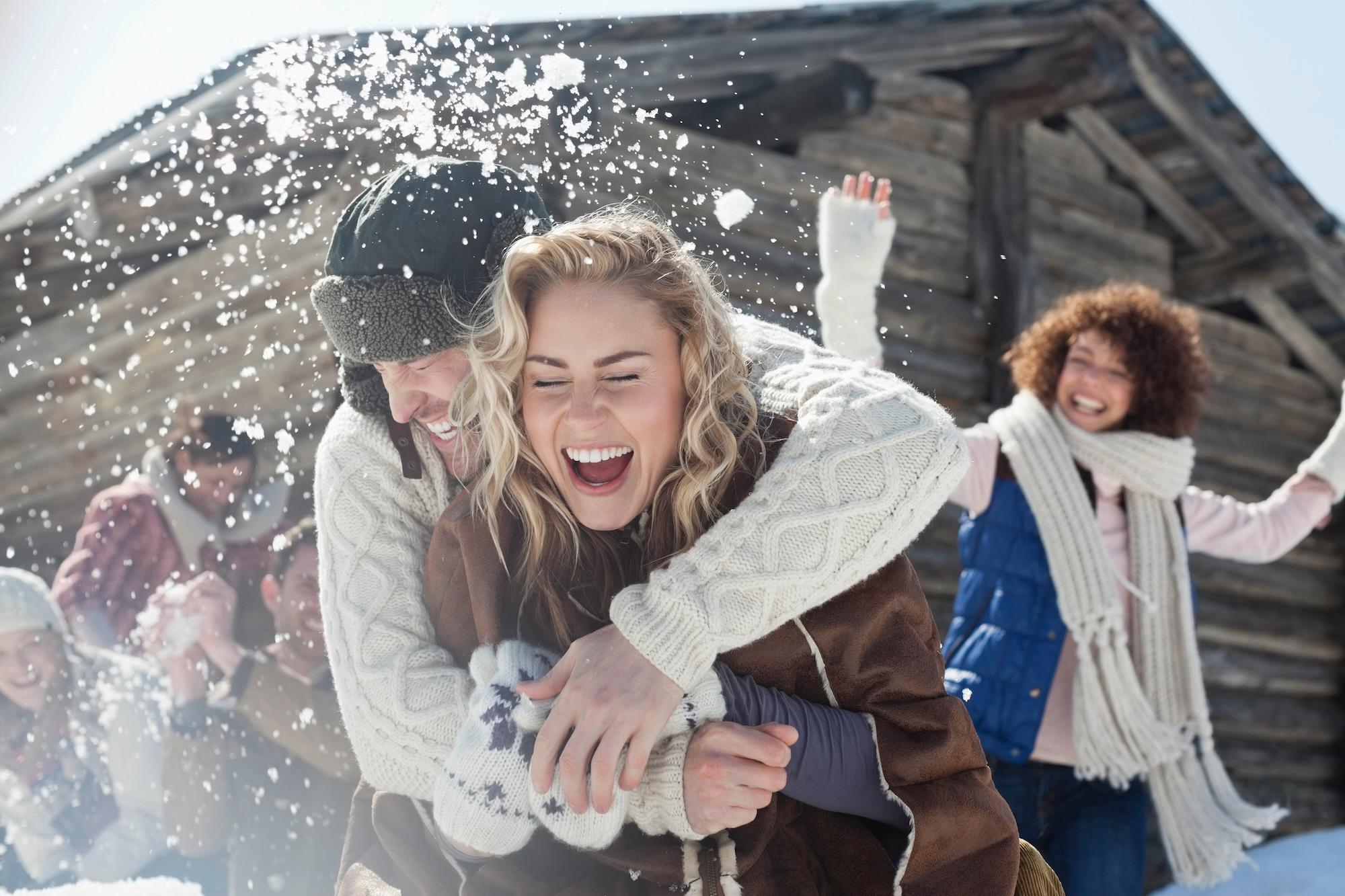 Friends enjoying snowball fight