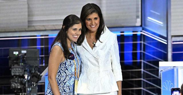 Nikki Haley (R) and her daughter Rena Haley (L) pose for photos following the third Republican presidential primary debate at the Knight Concert Hall at the Adrienne Arsht Center for the Performing Arts in Miami, Flor., on Nov. 8, 2023