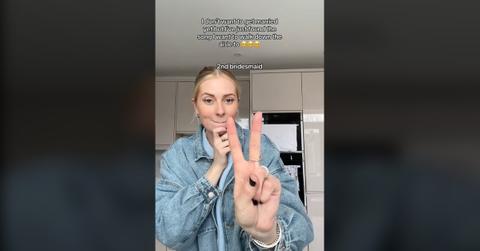 The TikToker who presumably started the "second bridesmaid running trend" set to "Ordinary."