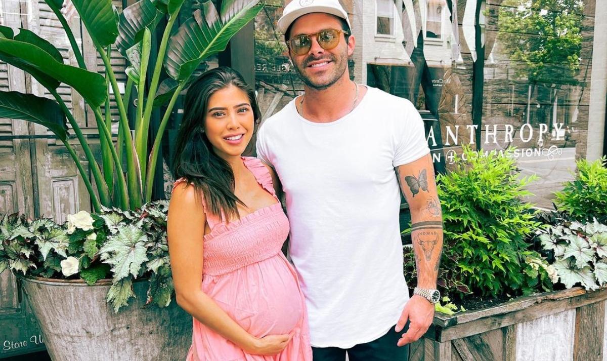 April shows off her bump with boyfriend Cody