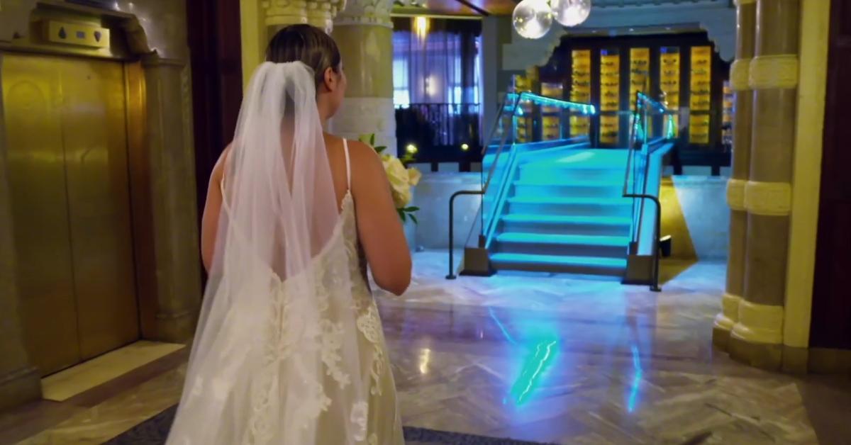 A bride walks toward a bridge on married at first sight