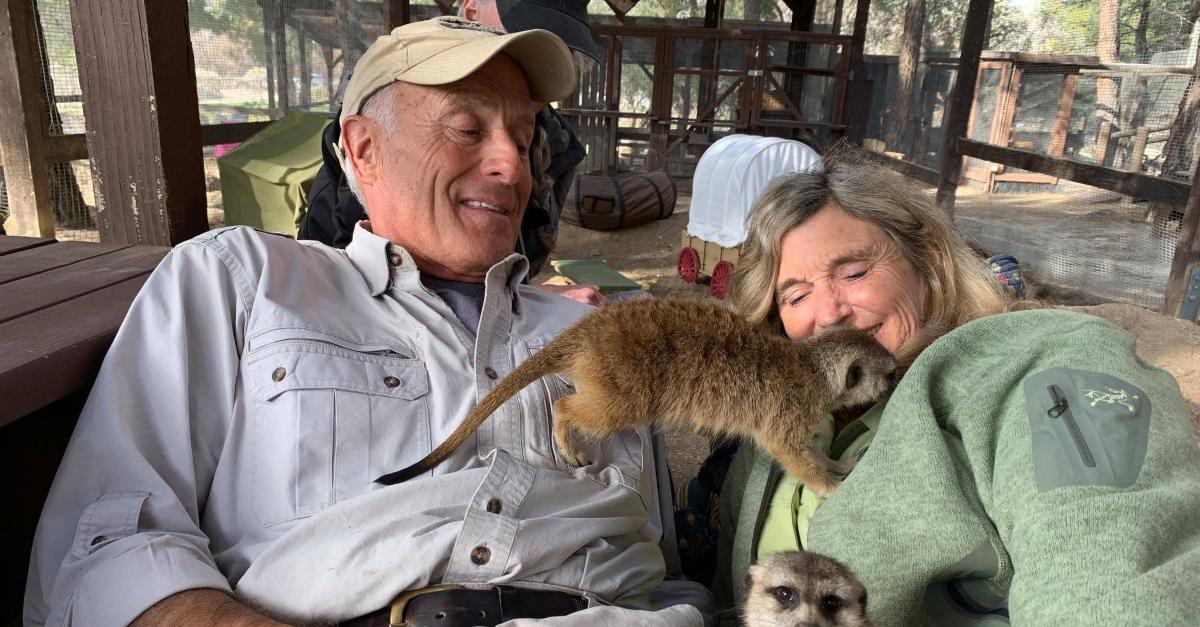 Jack Hanna and his wife, Suzi play with lemurs.