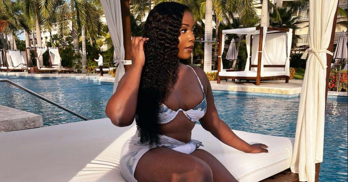 Michael Ilesanmi's alleged girlfriend, Megan, poses at a pool side cabana in a bikini.