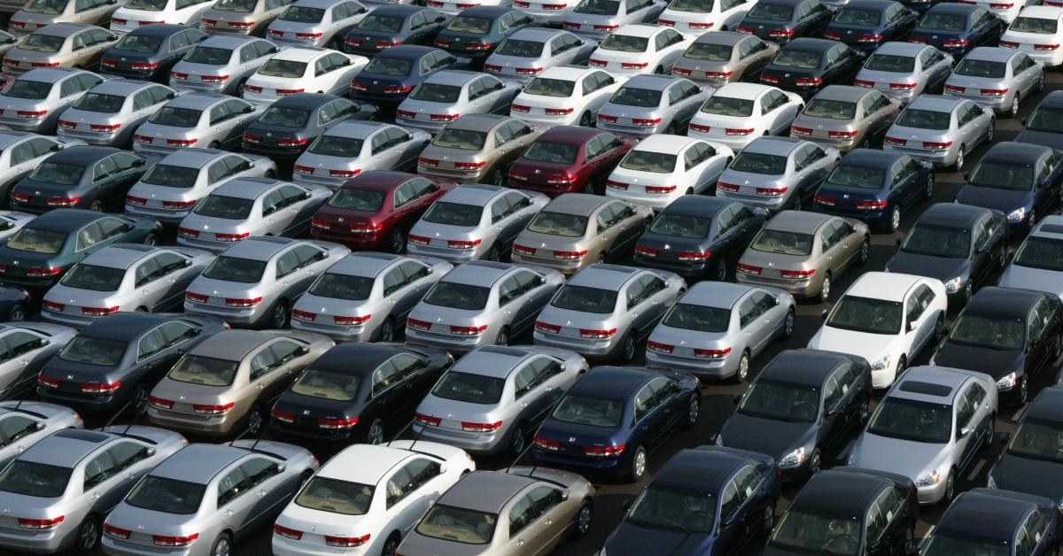 Cars lined up in a parking lot.