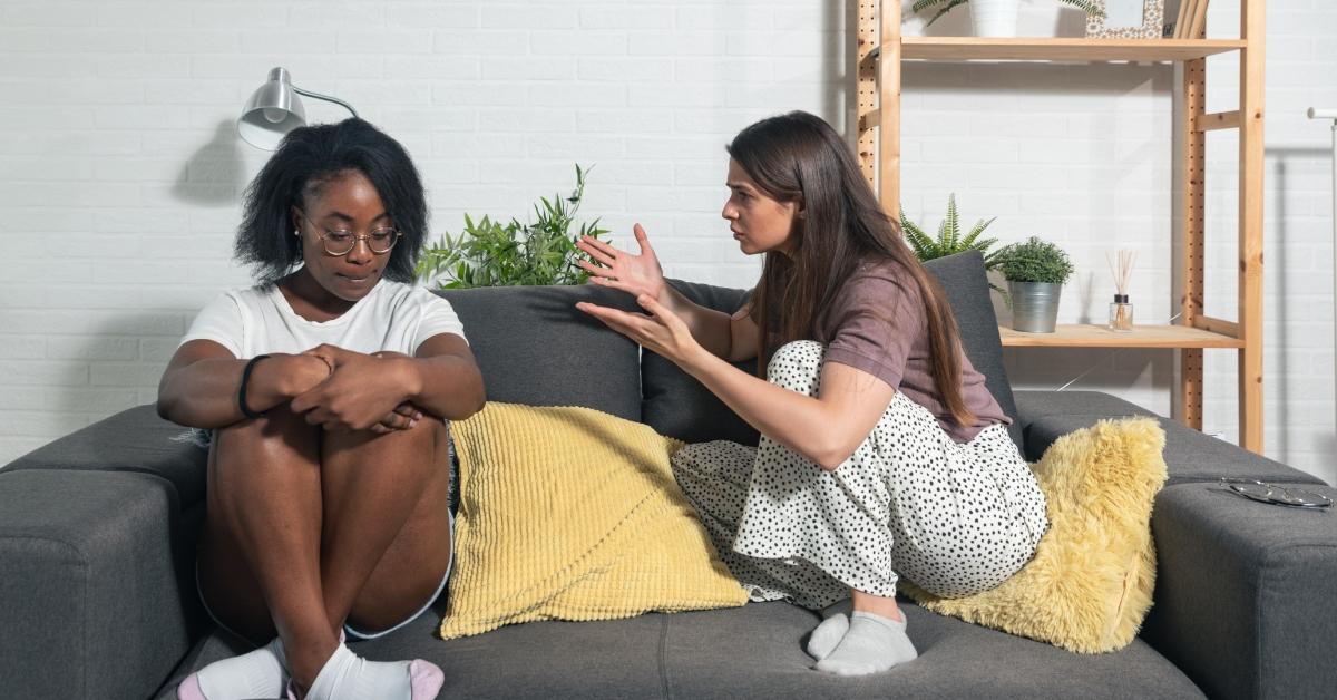 two women argue in their apartment 