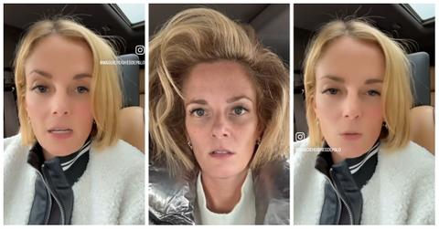 A woman shows the results of a wild blowout she got at a hair salon