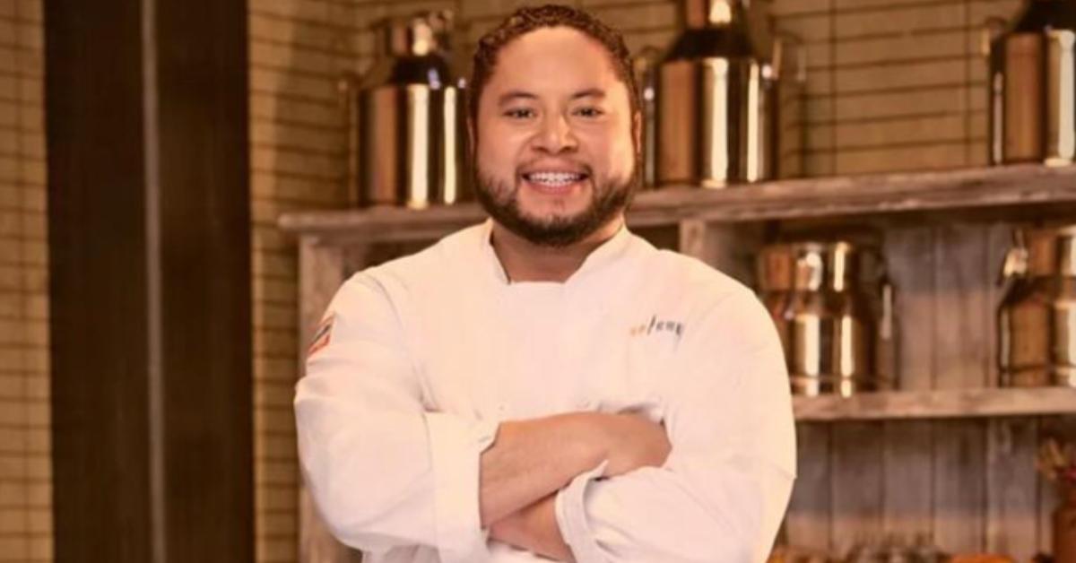 Kenny Nguyen wears a white chef's jacket for his official 'Top Chef: Wisconsin' portrait