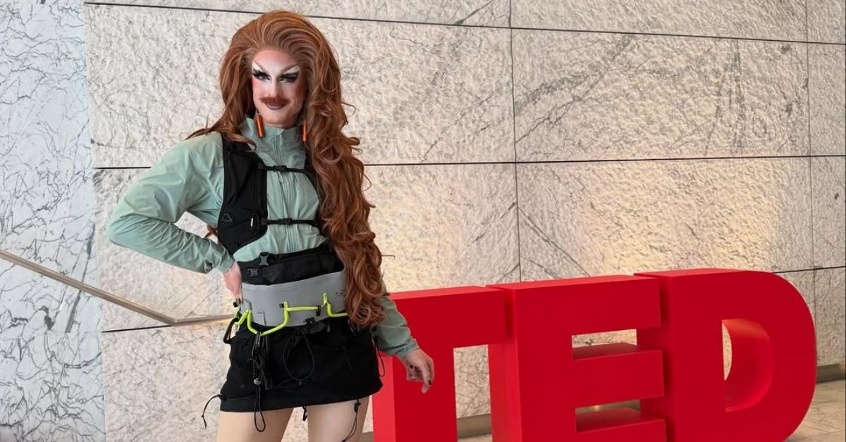 Pattie Gonia posing at a TED Talk