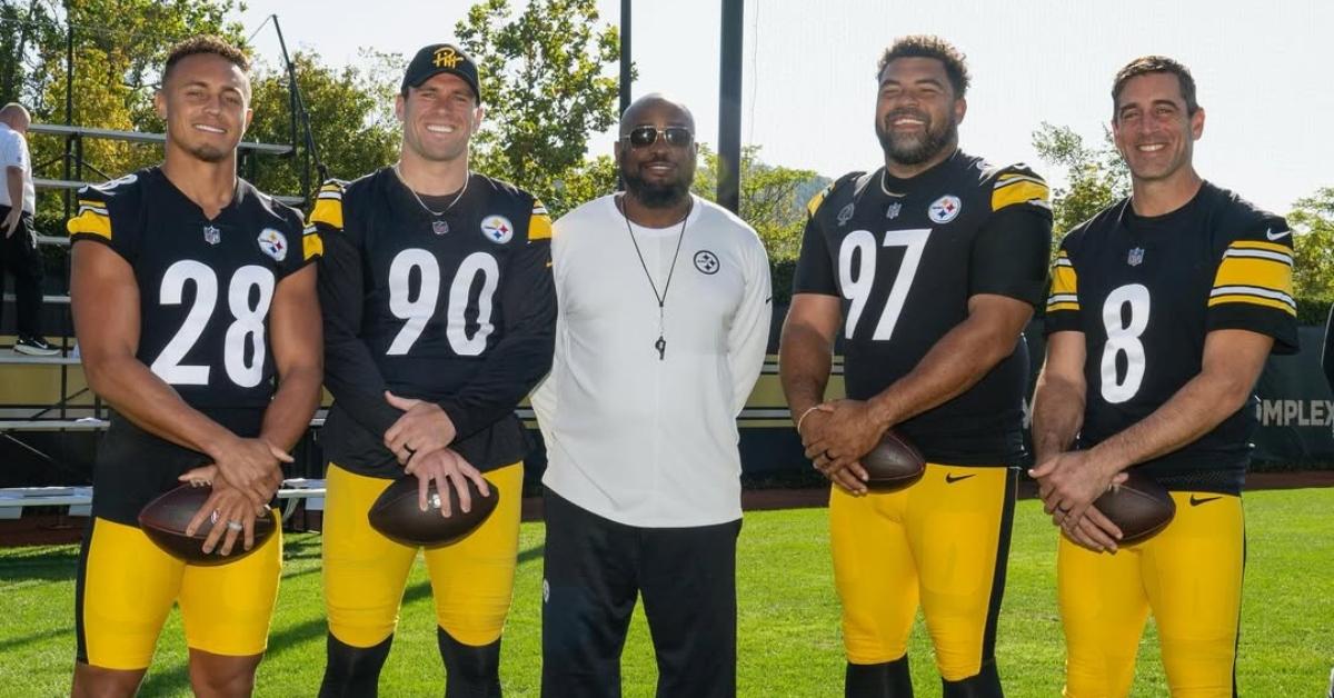 Mike Tomlin on the field with the Steelers captains.