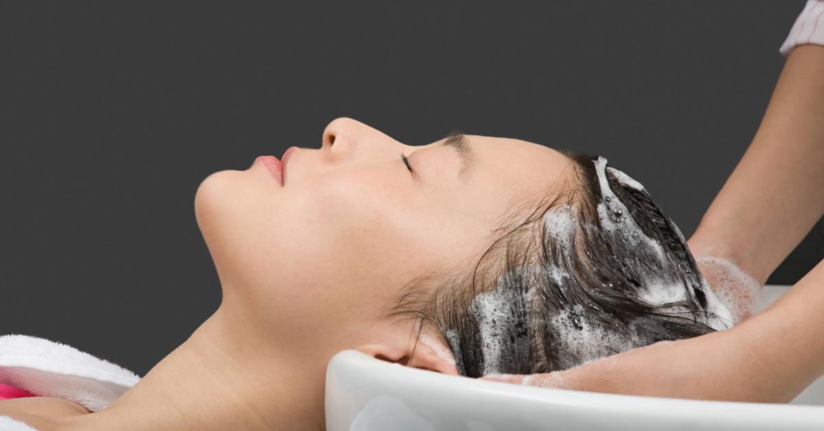 Woman Shampooing Hair Getty