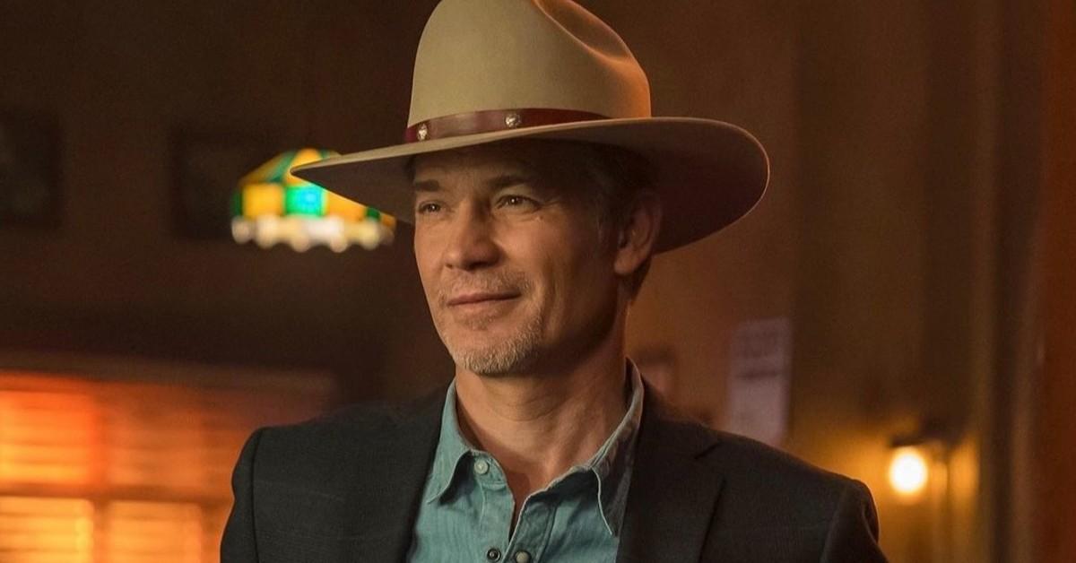 Raylan Givens (Timothy Olyphant) in his signature cowboy hat, black blazer, and blue shirt on 'Justified: City Primeval'