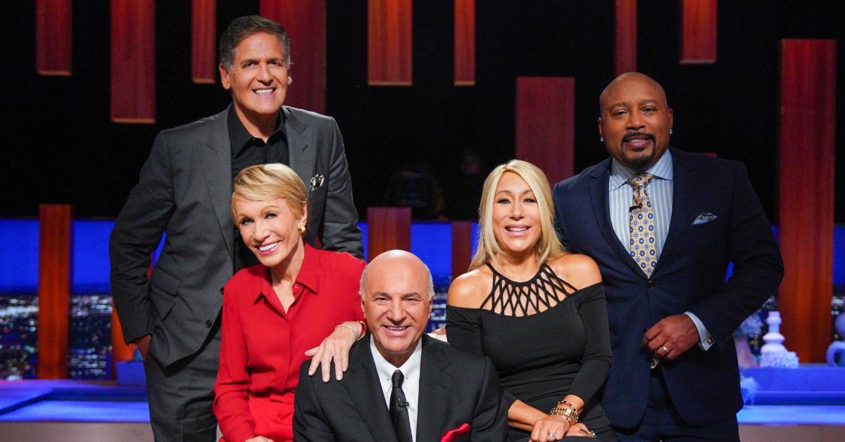 Mark Cuban, Barbara Corcoran, Kevin O’Leary, Lori Greiner, and Daymond John posing on 'Shark Tank'.