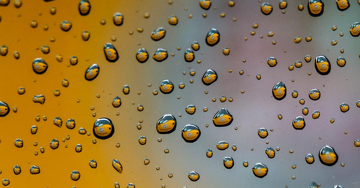 Glass with beads of water on it. 