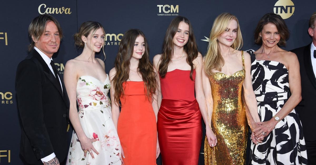 (l-r): Keith Urban, his and Nicole Kidman's children, Nicole Kidman, and a friend on the red carpet.