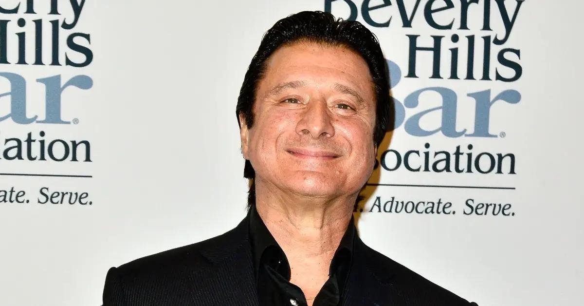 Steve Perry attending an event in a black suit.