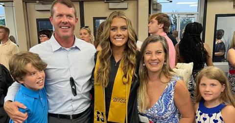 Bobby Moudy at a graduation ceremony with his family.