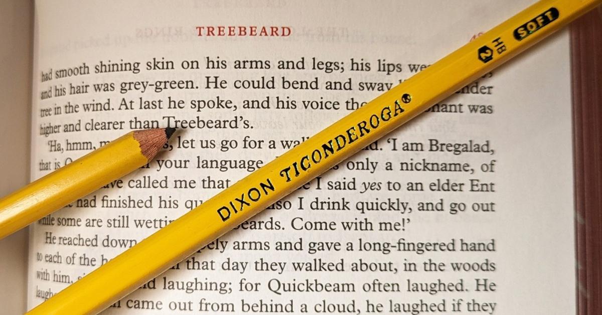 six-sided dixon ticonderoga yellow pencil on book