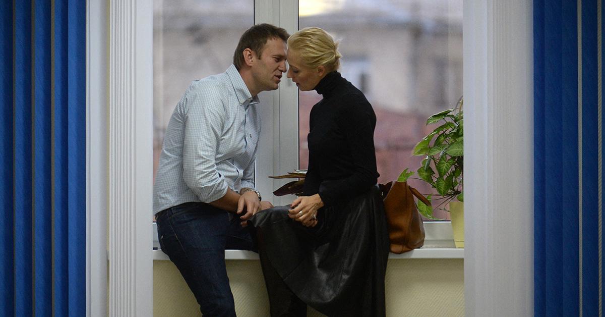 Alexei Navalny having an intimate moment with his wife in a window sill. 