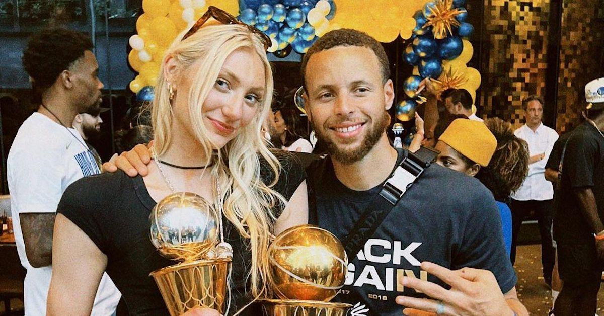 Stephen Curry with Cameron Brink smiling holding trophies