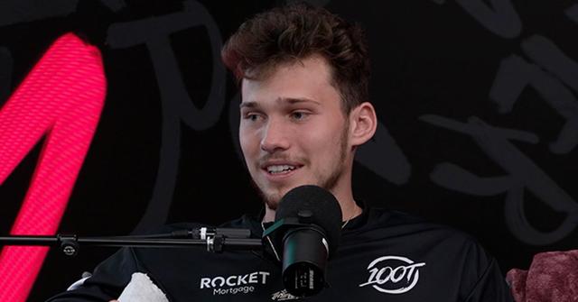 Jesser sitting in front of a mic for a podcast