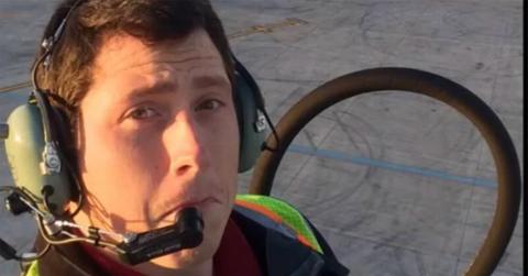 Richard Russell wearing headphones in a selfie.