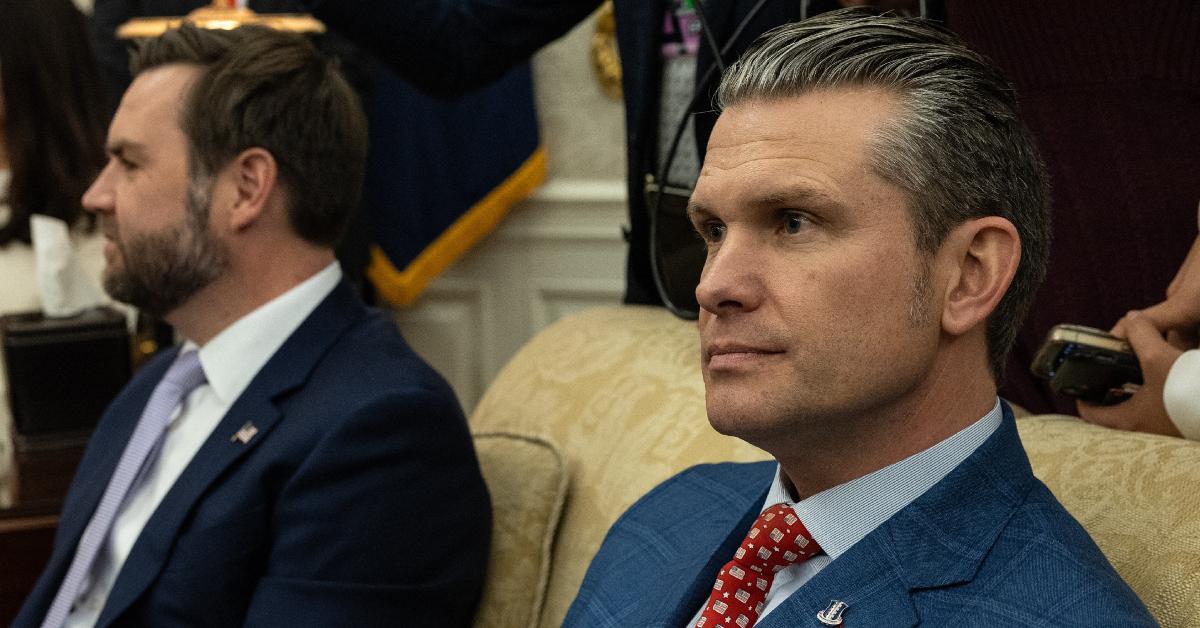 Pete Hegseth sitting beside J.D. Vance.