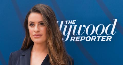 Lea Michele posing on the red carpet at an event.
