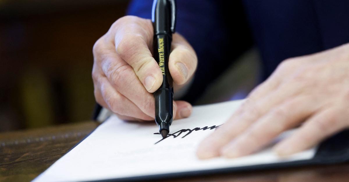 Trump using a Sharpie to sign orders