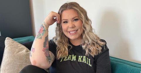 kail lowry sitting on couch