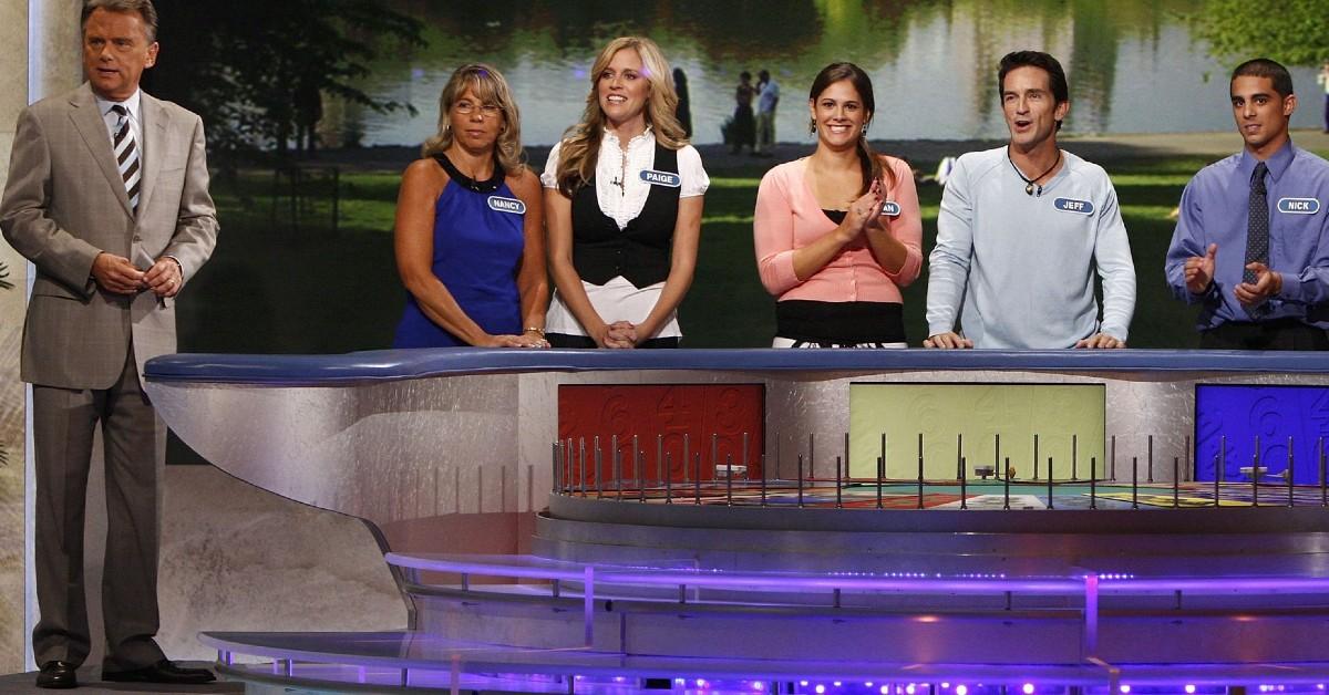 Pat Sajak and contestants on 'Wheel of Fortune' 