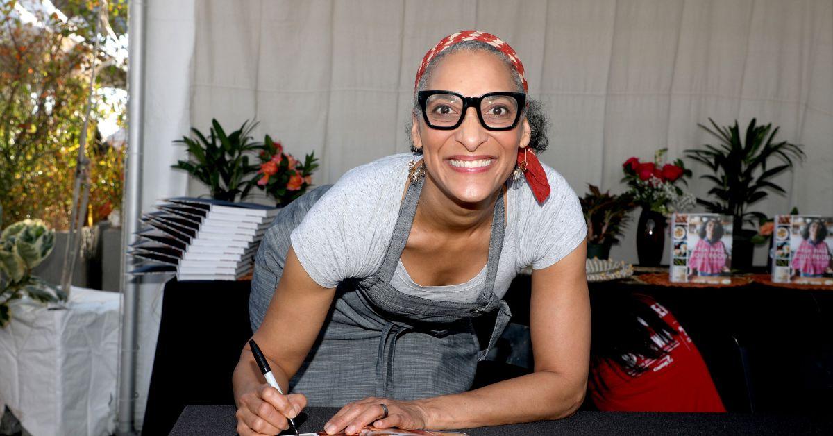 Carla Hall posing at her book signing,