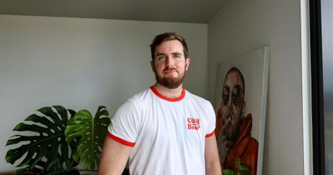 girthmasterr posing in white t-shirt