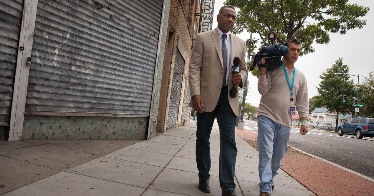 Derrick Ward walking in Washington D.C. with a cameraman. 